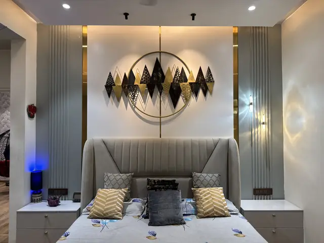 Bed headboard wall with circular metal artwork - Ms. Rashmi project, Bangalore