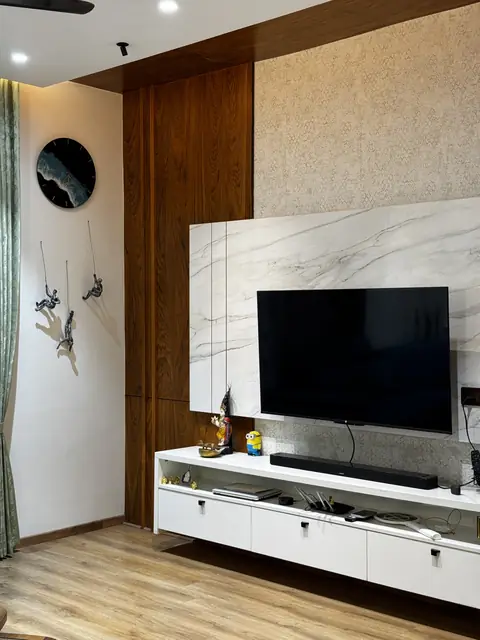 Marble-finish television wall with floating console - Ms. Rashmi project, Bangalore