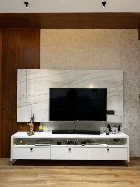 Television unit against stone-finish feature wall - Ms. Rashmi project, Bangalore