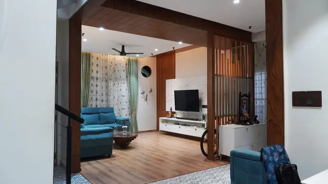 Living room framed by timber partition screen - Ms. Rashmi project, Bangalore